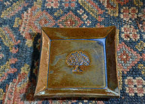 This is a snack plate for your desk, jewelry dish for your bedside table, or landing zone for your favorite mug. Use it for whatever needs a spot to rest. Stamped with a tree of life. Lara Gillett. Tree of Life. Quittner.
