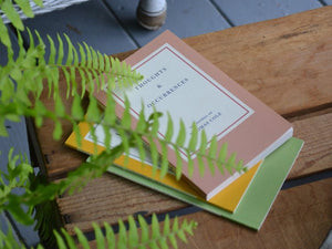 a book and a book on a wooden table 