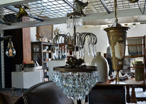 Very large and heavy antique French crystal chandelier with a cluster of small bulbs that offer a glittering glow. Quittner.