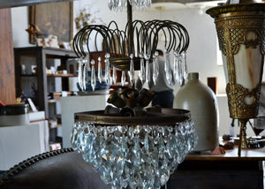 Very large and heavy antique French crystal chandelier with a cluster of small bulbs that offer a glittering glow. Quittner.