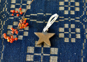 A simple star ornament for holiday decorations. Made in by us in the Hudson Valley of New York.