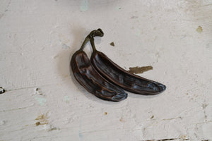 a pair of shoes sitting next to a pair of scissors 