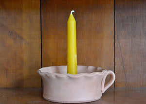 Our pure beeswax tapers are each hand-poured in antique metal candle molds. Imperfections are the result of the age of the molds and the miles they've traveled. Single candle. Short taper, 6 inches, mini taper, terra cotta