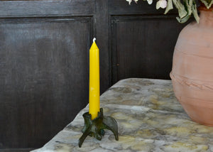 Our pure beeswax tapers are each hand-poured in antique metal candle molds. Imperfections are the result of the age of the molds and the miles they've traveled. Single candle. Short taper, 6 inches, mini taper, bronze vertebra
