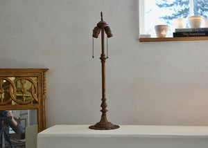 Antique two-light table lamp without shade. Unmarked. Wired with 6 feet of antique gold twisted cloth-covered cord. Quittner
