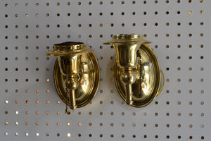 This is a mismatched pair of antique brass pull-chain sconces. They have been rewired, and are ready for use. The brass will patina with time. Sold together.