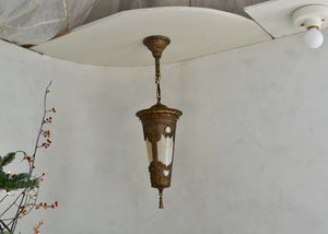 Ornate brass-tone vintage pendant light with slag glass. Fully rewired. Please look carefully at images to confirm condition. Quittner.