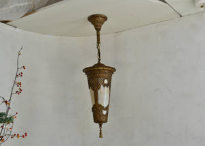 Ornate brass-tone vintage pendant light with slag glass. Fully rewired. Please look carefully at images to confirm condition. Quittner.