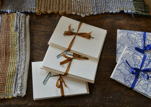 Set of 5 handprinted paper notecards on creamy white paper with matching envelopes featuring a vintage garden rake. These cards are designed and made in collaboration with Invisible Hand, a woman-owned printing studio in Tivoli, New York. Each card is printed using antique printing blocks and a vintage press, creating conscious individuality between each piece. Quittner.