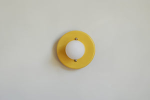 This porcelain surface mount or flush mount-style light is designed to be installed on a ceiling or as a wall sconce, alone or in multiples. Inspired by a 1930s fixture. Designed and made in the Hudson Valley.

The Marigold color is one of a trio of colors released in collaboration with Hudson Valley interior design firm Hendley and Co.