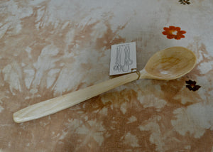 Hand-carved wood spoon for cooking and serving made of black birch, with an elegant rounded bowl. Ideal for scooping grain salads and vegetable sides.

Dimensions: 13 3/8 inches long

This piece was carved by Mark Power in the Hudson Valley of New York. He uses hardwoods local to the Hudson Valley sourced from fallen trees, and trimmings from local orchards, to create functional cookware that lasts far past a lifetime. Mark carves while the wood is green, or still fresh, using edge tools. 