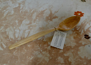 Hand-carved wood spoon for cooking and serving made of black birch, with an elegant rounded bowl. Ideal for scooping grain salads and vegetable sides.

Dimensions: 13 1/4 inches long

This piece was carved by Mark Power in the Hudson Valley of New York. He uses hardwoods local to the Hudson Valley sourced from fallen trees, and trimmings from local orchards, to create functional cookware that lasts far past a lifetime. Mark carves while the wood is green, or still fresh, using edge tools. 