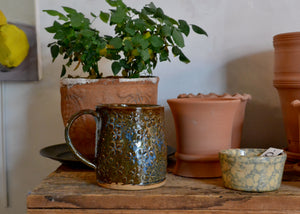 This large 16oz mug was handmade by potter Lara Gillett using slab-building techniques. It features a&nbsp;flower motif, and you will receive the exact mug shown. Quittner. Hudson Valley.