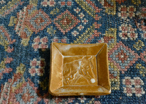 This is a small snack plate for your desk, ring dish for your bedside table, or landing zone for a wet tea bag. Use it for whatever needs a small spot to rest. Stamped with a horse in profile and finished with a creamy glaze. Quittner. Lara Gillett. Hudson Valley. 