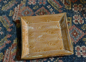 This is a snack plate for your desk, jewelry dish for your bedside table, or landing zone for your favorite mug. Use it for whatever needs a spot to rest. Waves stamp and creamy glaze. Lara Gillett. Quittner. Hudson Valley