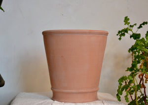 Large planter pot hand-thrown in terra cotta with simple banding on the bottom third. No drainage hole, so this pot is ideal for use as a cachepot, with a nursery pot inside, or a plant that likes sustained moisture. Firehouse Pottery Co. Quittner. 