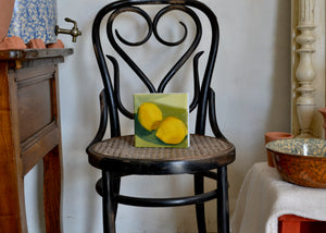 This little lemon is perfect for sitting in a window sill or kitchen counter. Acrylic on canvas. Signed on the reverse by Jessica Weinberg. For Quittner. Painted in Athens, NY. Hudson Valley art. Green background.