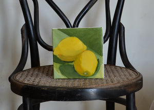 This little lemon is perfect for sitting in a window sill or kitchen counter. Acrylic on canvas. Signed on the reverse by Jessica Weinberg. For Quittner. Painted in Athens, NY. Hudson Valley art. two yellows on green background.