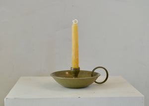 Our night cap candle stick form was inspired by visions of walking down the stairs, late at night, candle in hand, cap on head, all to get a snack. Each piece is hand-thrown and unique. Quittner