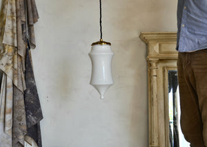 Pendant light featuring a vintage blown opaque glass form and brass details, offering a warm glow. Rewired. Please look carefully at images to confirm condition. Quittner.