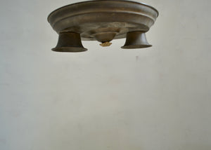 vintage metal Ceiling light fixture on a plain wall