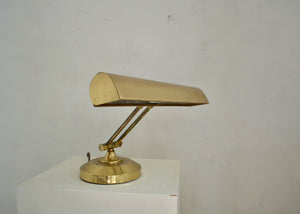 Vintage metal desk lamp with adjustable neck and shade. Newly rewired with a cloth-covered cord. Quittner