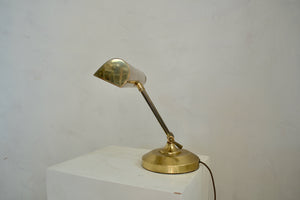 Vintage metal desk lamp with adjustable neck and shade. Newly rewired with a cloth-covered cord. Quittner