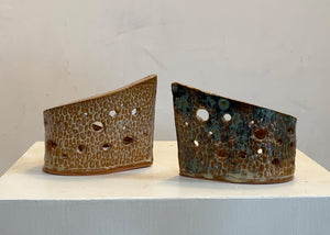 This tea light luminary was handmade by potter Lara Gillett using slab-building techniques. It features a spot motif and a choice of glaze.