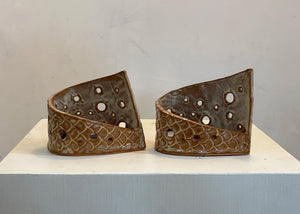 This tea light luminary was handmade by potter Lara Gillett using slab-building techniques. It features a scale motif and a choice of glaze.