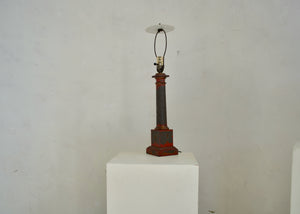 Antique metal table lamp with extant red paint, restored and rewired in our workshop. Quittner.