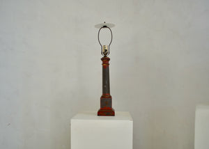 Antique metal table lamp with extant red paint, restored and rewired in our workshop. Quittner.