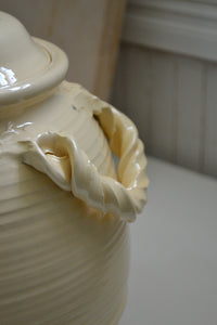 A creamy kitchen crock with lid by potter Jessica Weinberg of Firehouse Pottery Co, part of her Summer 2025 body of work. Quittner.