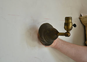 Antique brass sconce with wear and patina, including paint smudges. Fully rewired. Please look carefully at images to confirm condition. Switch on socket. Quittner.