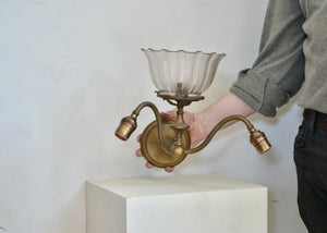 Unique pair of antique Victorian three-light sconces with a central light with shade and two downwards facing sockets on either side. Quittner.