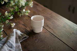 An elegant cup for every beverage at every temperature. This form is inspired by ceramics found in archaeological digs at the Historic 1747 Parsonage in Germantown, New York. Coffee cup, wine cup, porcelain, linen, old house style, white porcelain