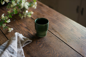 An elegant cup for every beverage at every temperature. This form is inspired by ceramics found in archaeological digs at the Historic 1747 Parsonage in Germantown, New York. Coffee cup, wine cup, porcelain, linen, old house style, dark green, forest green