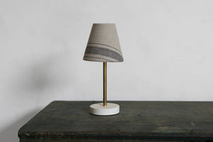 Our surface lamp is the perfect small lamp for your counter, dresser, desk, or bedside table. Brass and porcelain with linen shade, classic, simple, clean design, old house style, cottage, English