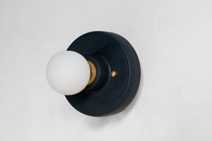 This porcelain surface mount or flush mount-style light is designed to be installed on a ceiling or as a wall sconce, alone or in multiples. Inspired by a 1930s fixture, this light is the perfect solution for a home with lower ceilings or an old house remodel that is seeking to be connected to the past. Designed and made in the Hudson Valley.