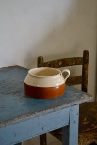 a coffee cup sitting on top of a wooden table 
