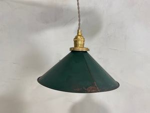 a green umbrella hanging from a rope 